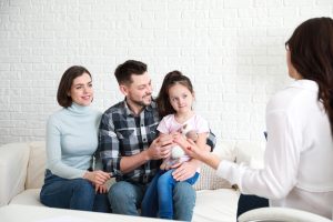 Family visiting psychologist in office