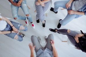 A group of teens sitting together