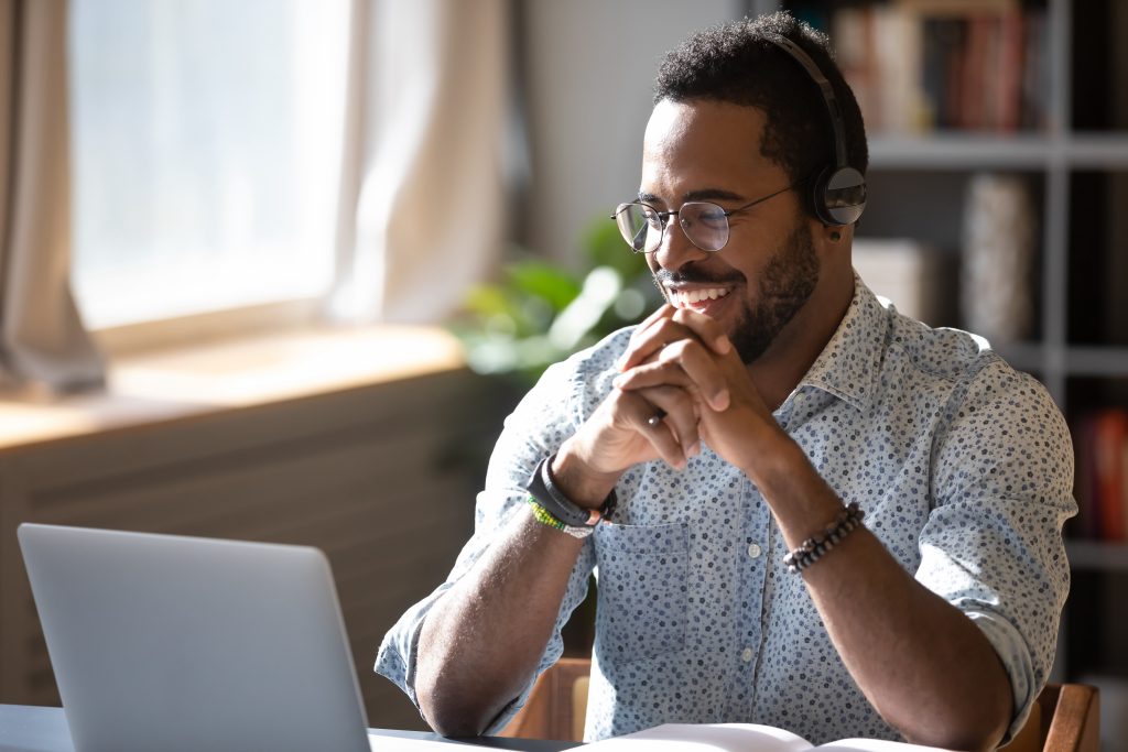 Man doing therapy via telehelath on his computer